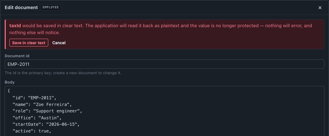 The same editor refusing to save: taxId would be written in clear text, with a Save in clear text button beside Cancel